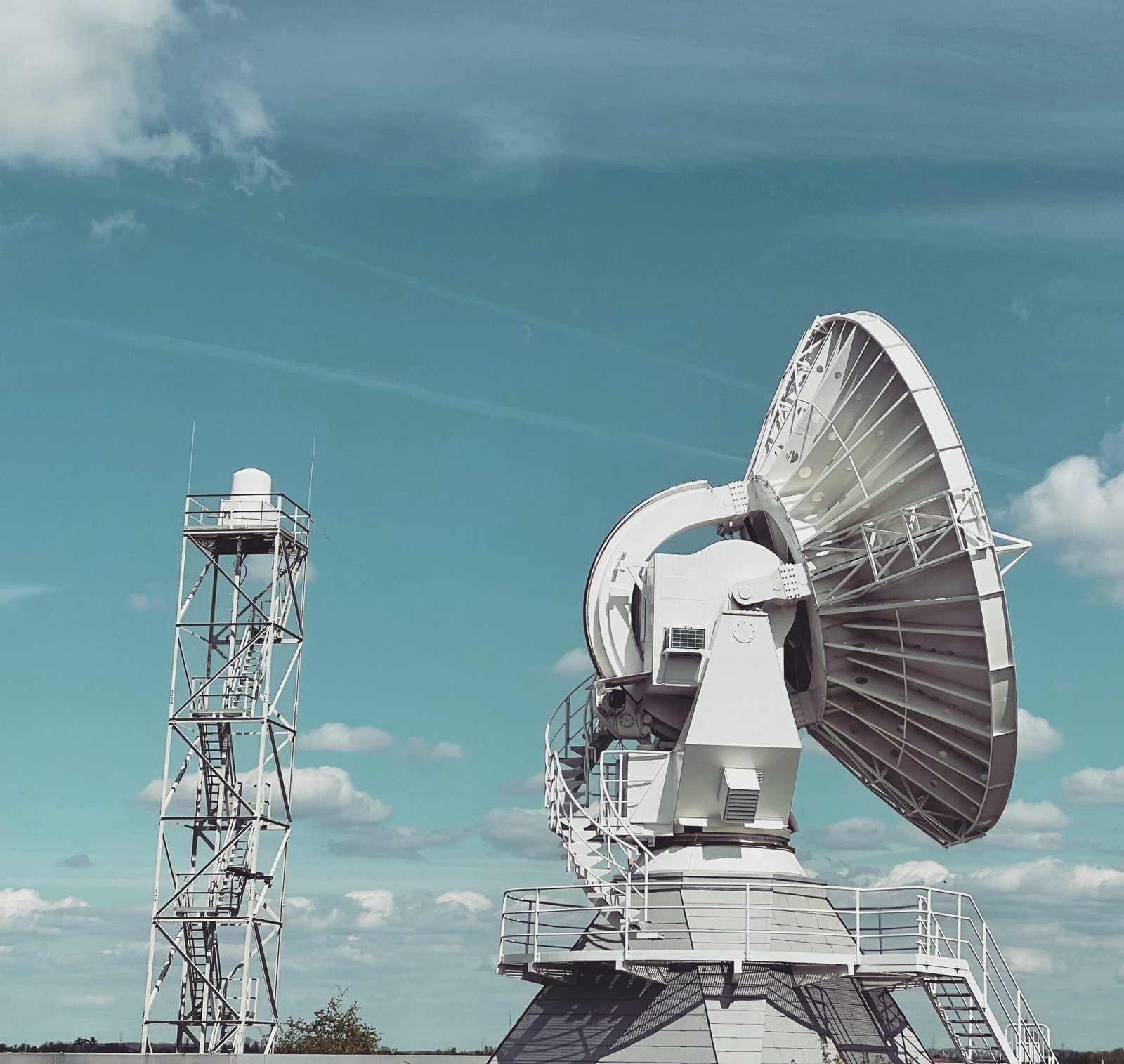 Satellite earth station dish and communications tower